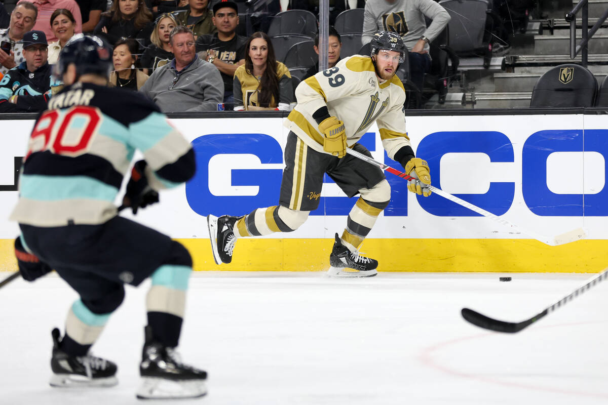 Golden Knights right wing Anthony Mantha (39) looks to pass while Kraken left wing Tomas Tatar ...