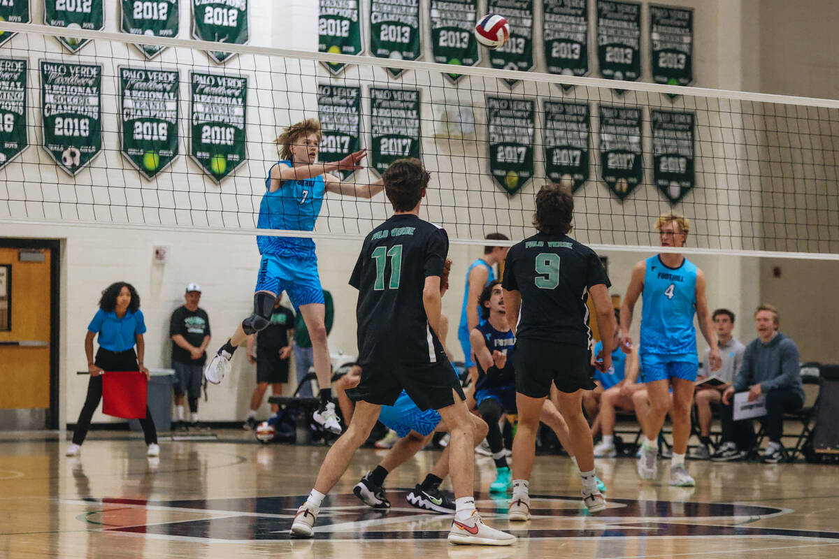 Foothill rightside hitter Corbin Putnam (7) hits the ball over the net during a game against Pa ...