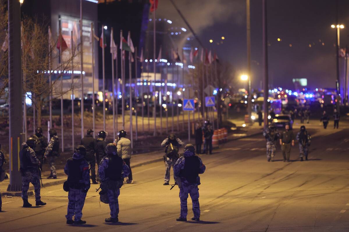 Russian Rosguardia (National Guard) servicemen secure an area near the Crocus City Hall on the ...