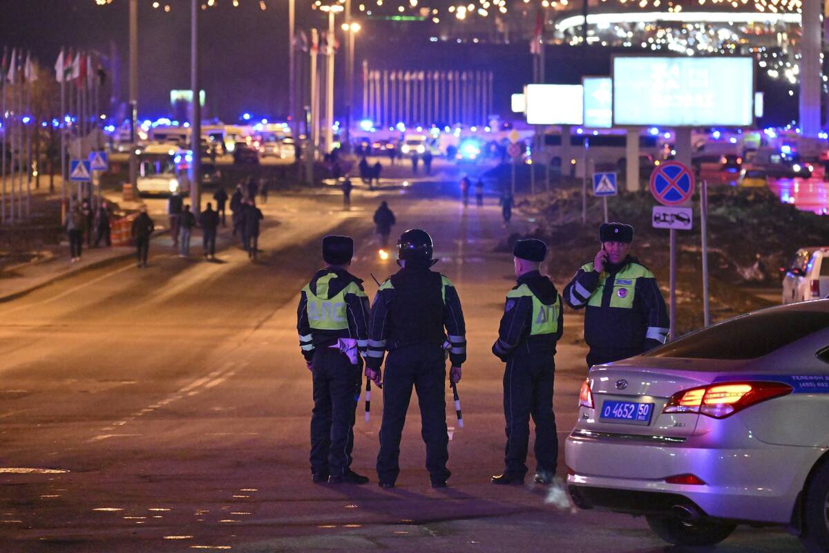 Police block the road to the Crocus City Hall on the western edge of Moscow, Russia, Friday, Ma ...