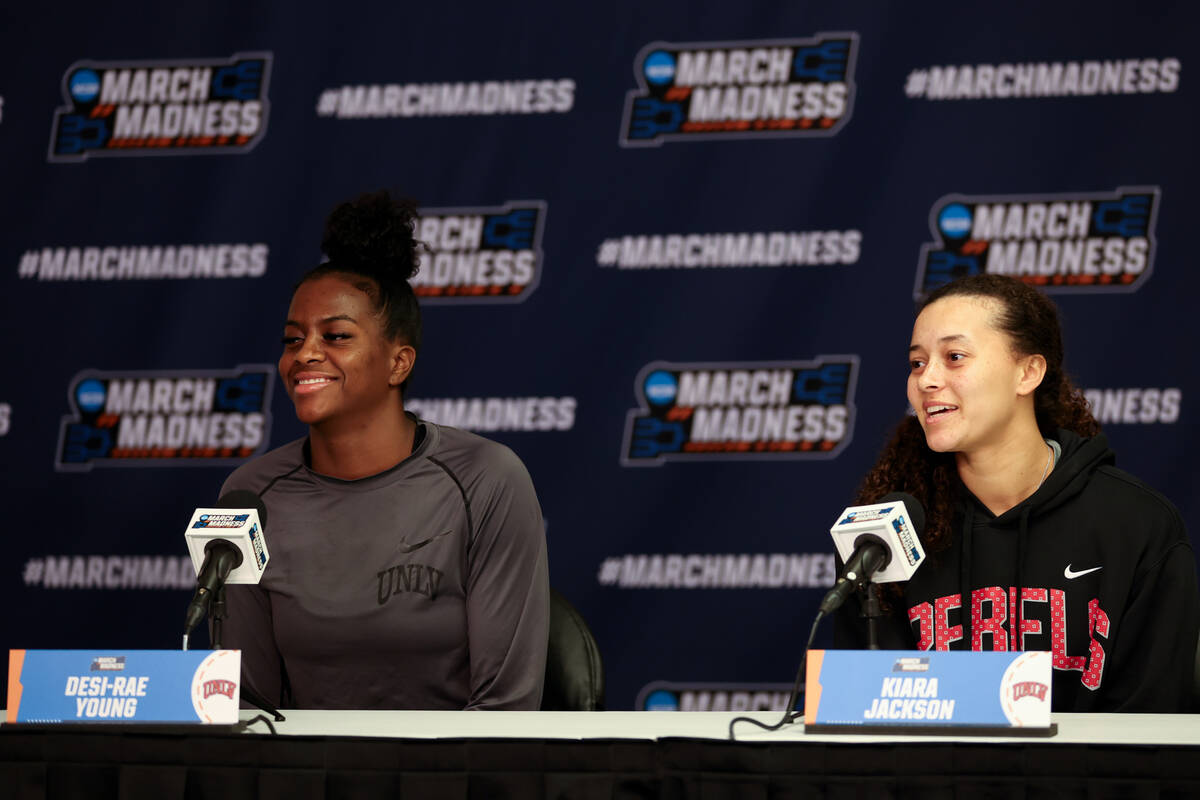 UNLV Lady Rebels center Desi-Rae Young, left, and guard Kiara Jackson laugh during a news confe ...