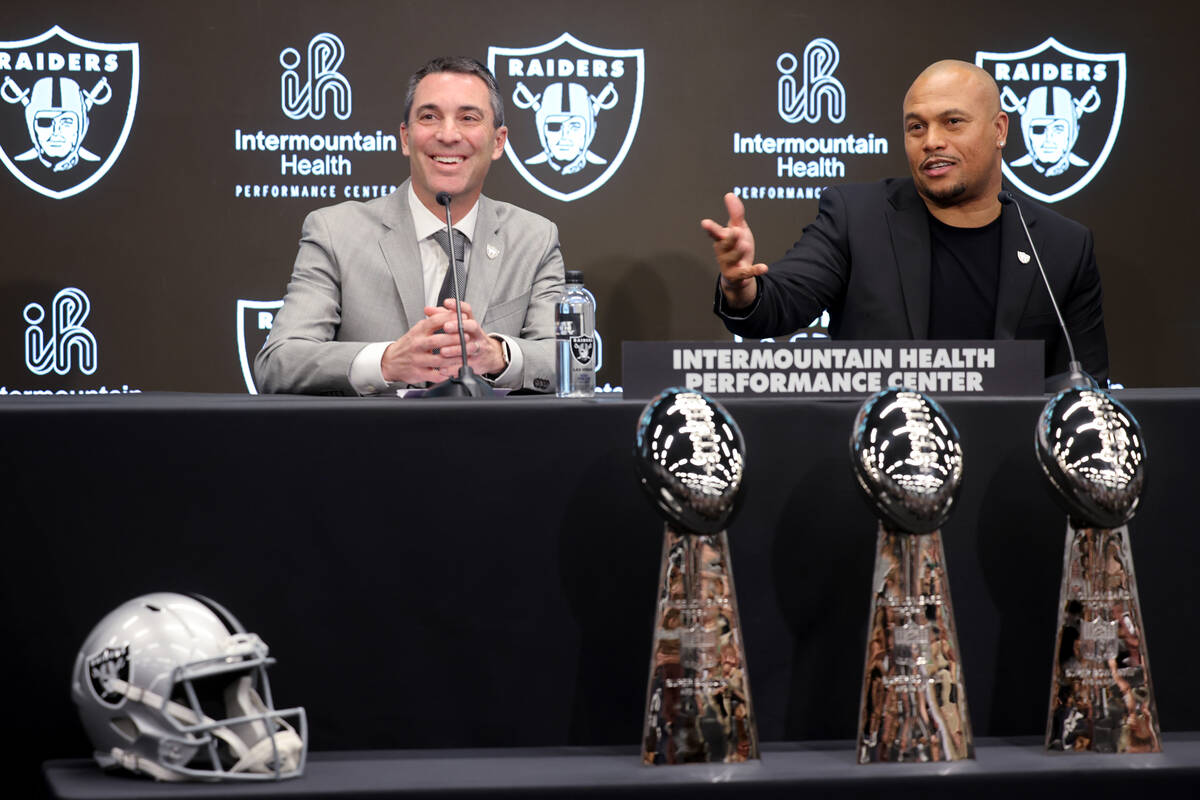 Tom Telesco, left, and Antonio Pierce are introduced as general manager and coach during a pres ...