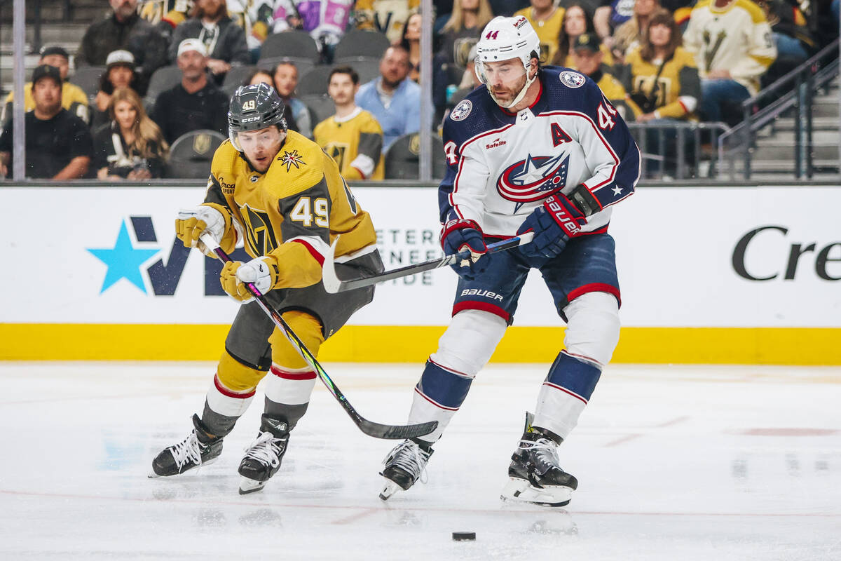 Golden Knights center Ivan Barbashev (49) and Columbus Blue Jackets defenseman Erik Gudbranson ...