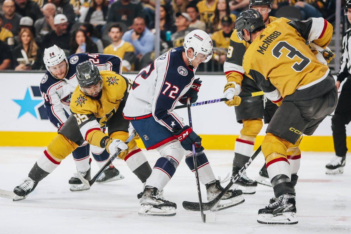 Columbus Blue Jackets right wing Carson Meyer (72) tries to skate past Golden Knights defensema ...
