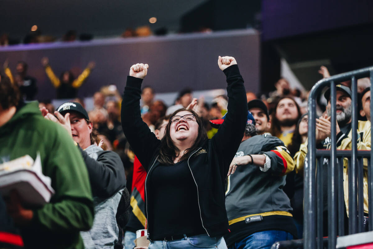 A fan celebrates a Golden Knights goal during an NHL hockey game between the Golden Knights and ...