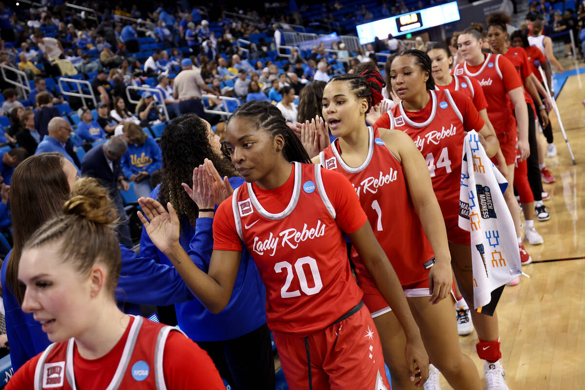 The UNLV Lady Rebels congratulate the Creighton Bluejays after they won a first-round college b ...