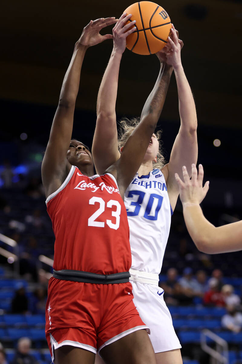 UNLV Lady Rebels center Desi-Rae Young (23) jumps for a rebound against Creighton Bluejays forw ...