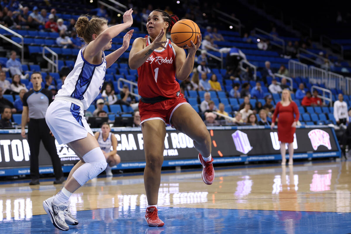 UNLV Lady Rebels forward Nneka Obiazor (1) drives toward the hoop against Creighton Bluejays fo ...