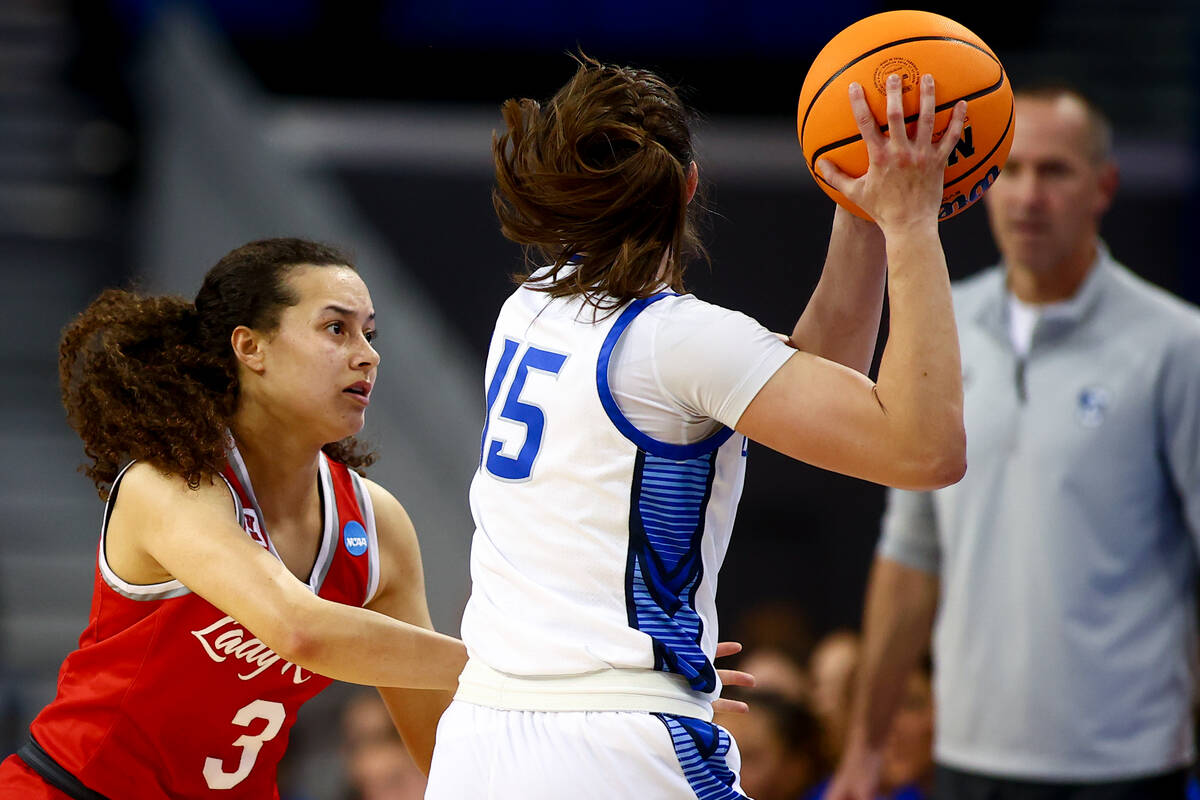 UNLV Lady Rebels guard Kiara Jackson (3) defends against Creighton Bluejays guard Lauren Jensen ...