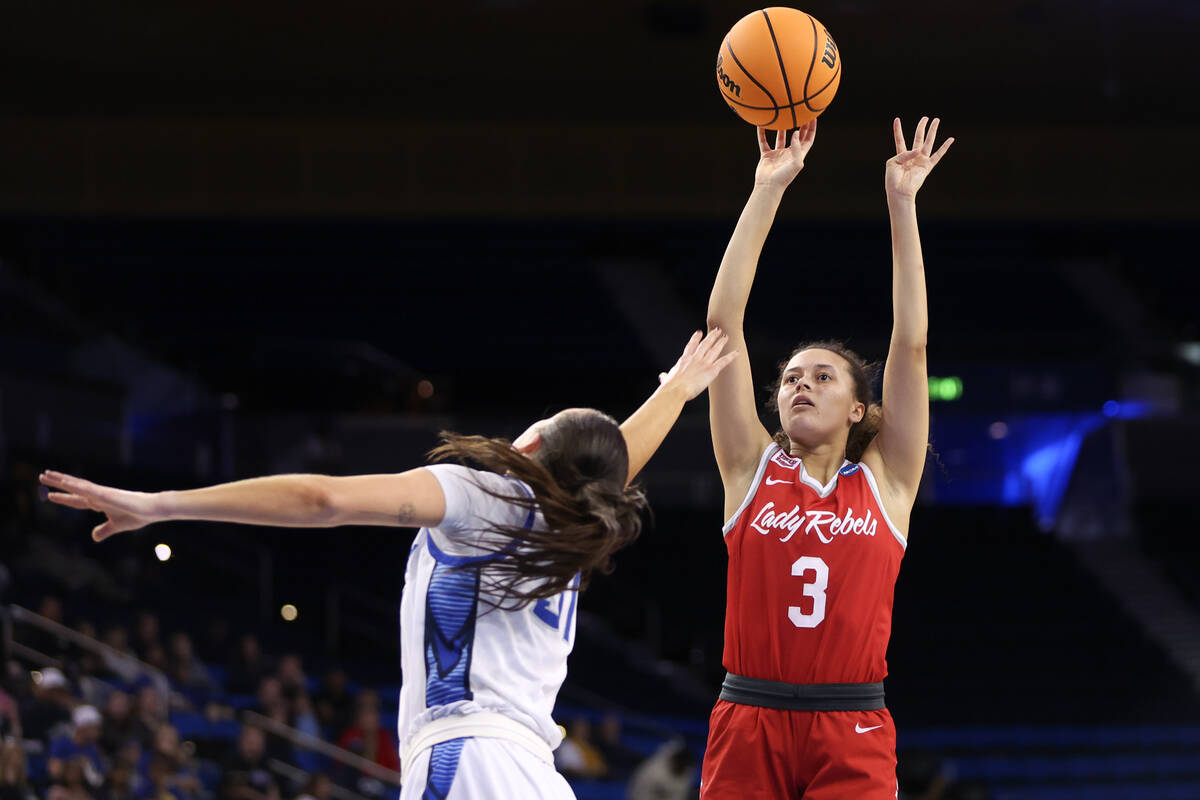 UNLV Lady Rebels guard Kiara Jackson (3) shoots against Creighton Bluejays forward Emma Ronsiek ...