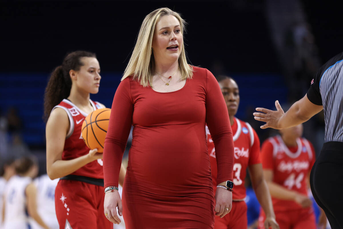 UNLV Lady Rebels head coach Lindy La Rocque addresses a referee as her team convenes for a time ...