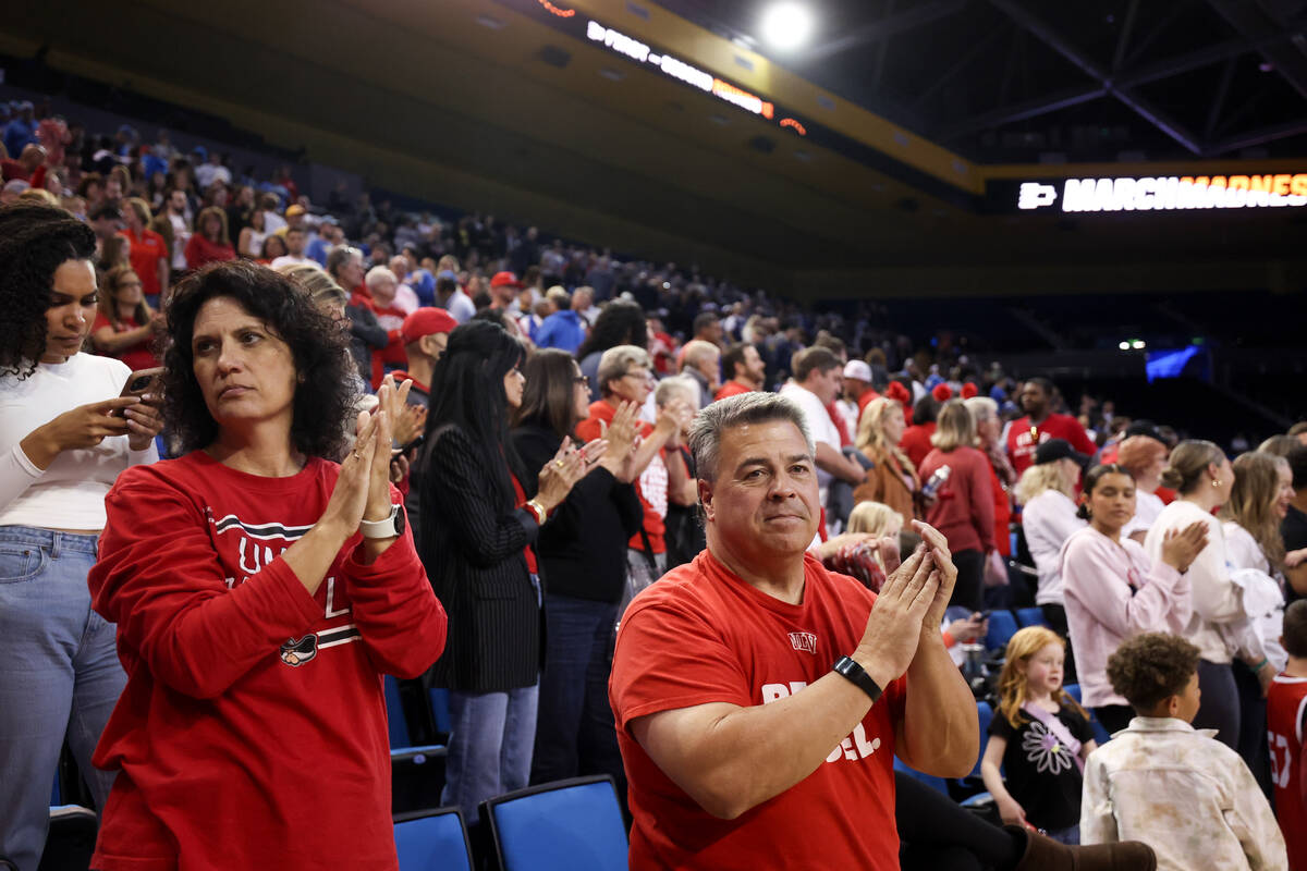 UNLV Lady Rebels fans applaud their team after they lost a first-round college basketball game ...