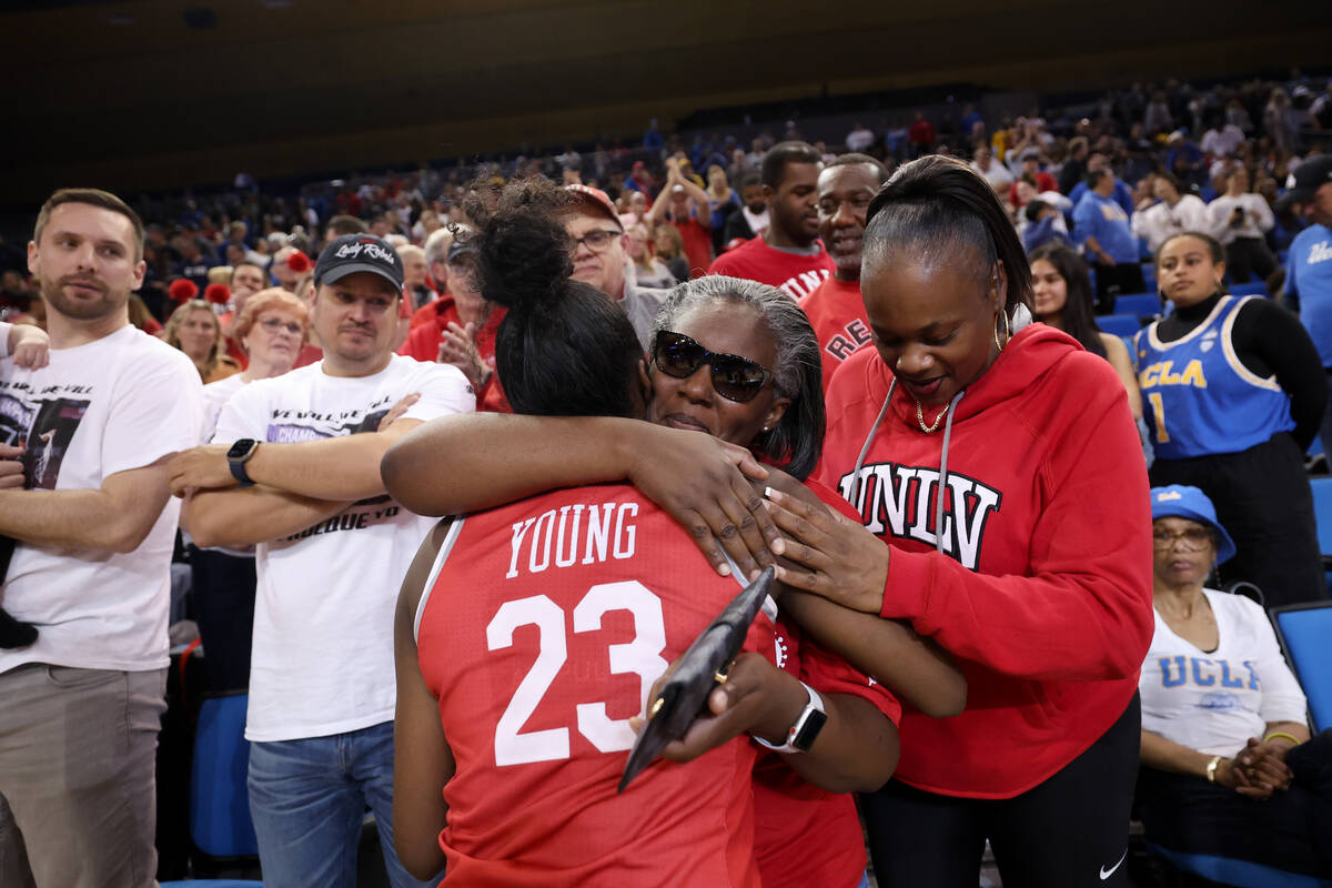 UNLV Lady Rebels center Desi-Rae Young (23) is embraces by family members after the Lady Rebels ...