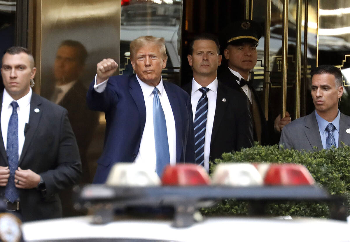 Former President Donald Trump leaves Trump Tower on April 13, 2023, in New York. (John Lamparsk ...
