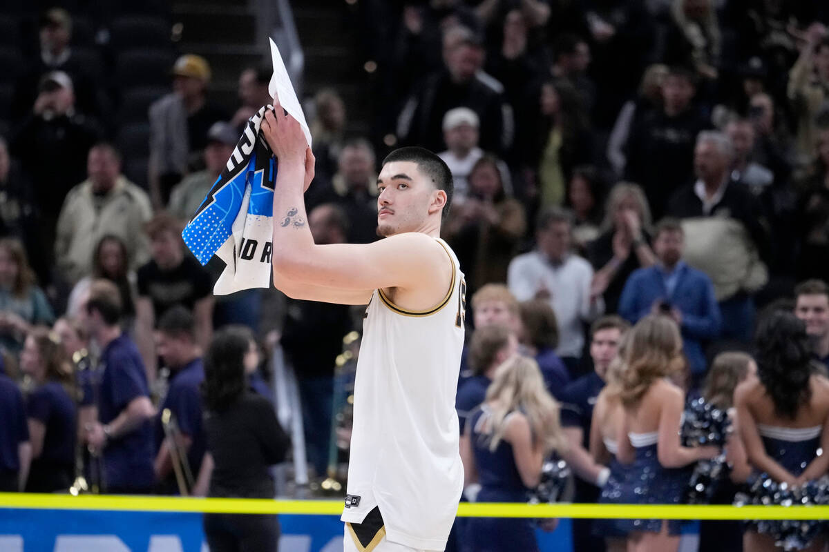 Purdue's Zach Edey applauds as he heads off the court following a second-round college basketba ...