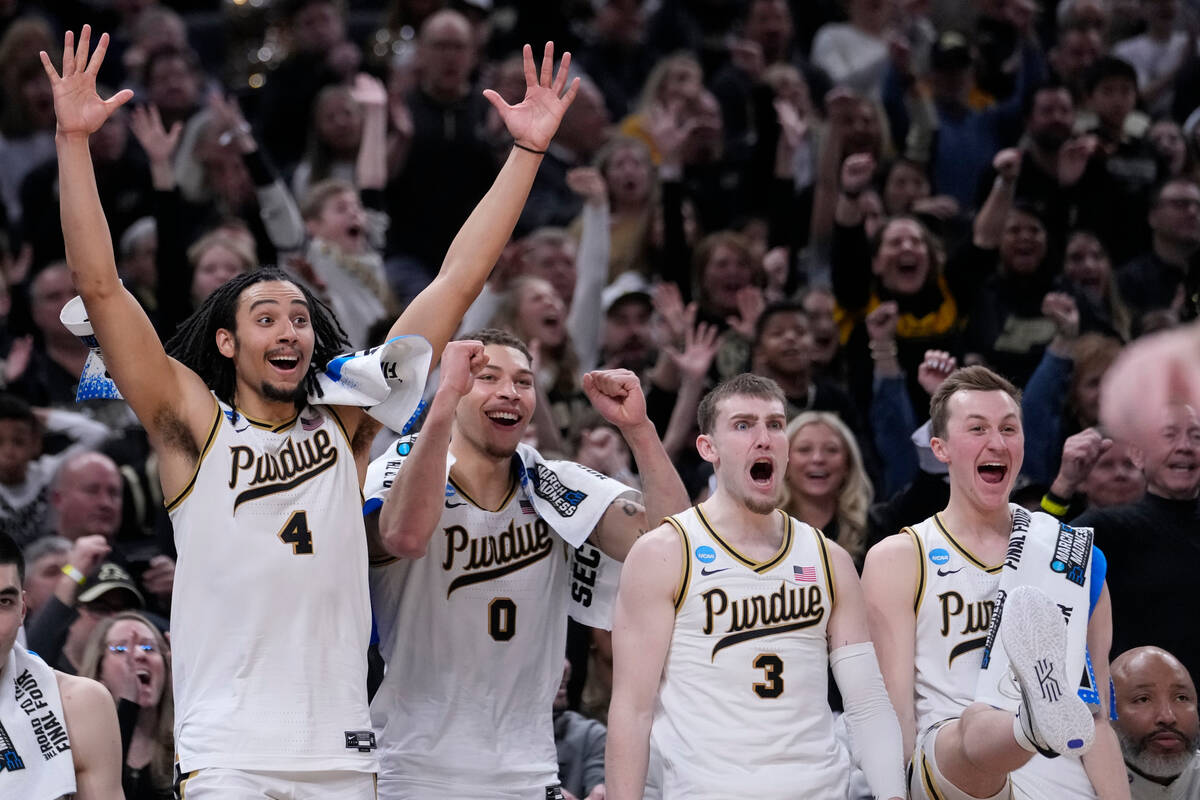 Purdue's Trey Kaufman-Renn (4) celebrates with teammates Mason Gillis (0), Braden Smith (3) and ...