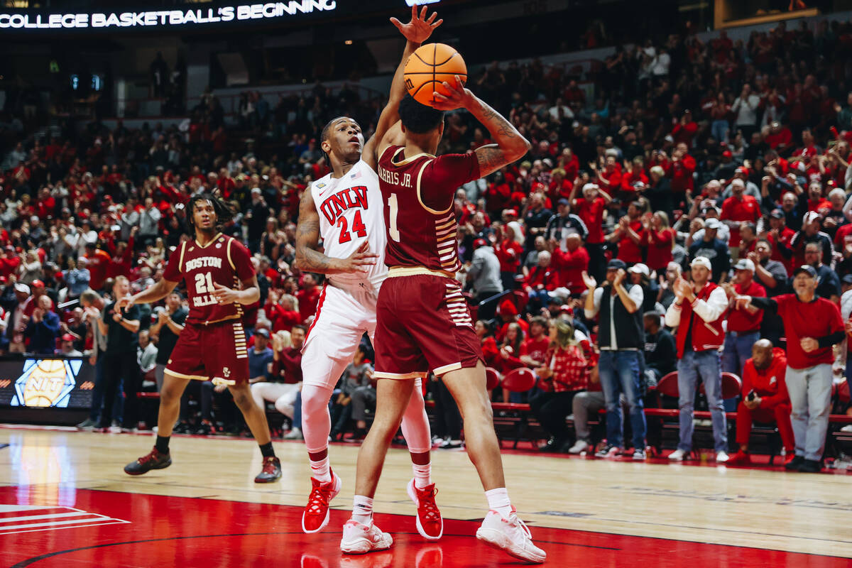 UNLV guard Jackie Johnson III (24) plays defense while Boston College guard Claudell Harris Jr. ...