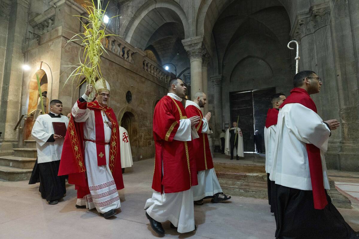 Pierbattista Pizzaballa, the Latin Patriarch of Jerusalem, Second from the left, walks in a pro ...
