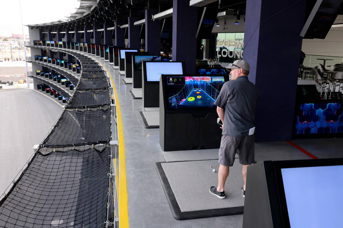 Dave Engstrom of Duluth, Minn. hits from a fourth floor bay at Atomic Golf adjacent to The Stra ...