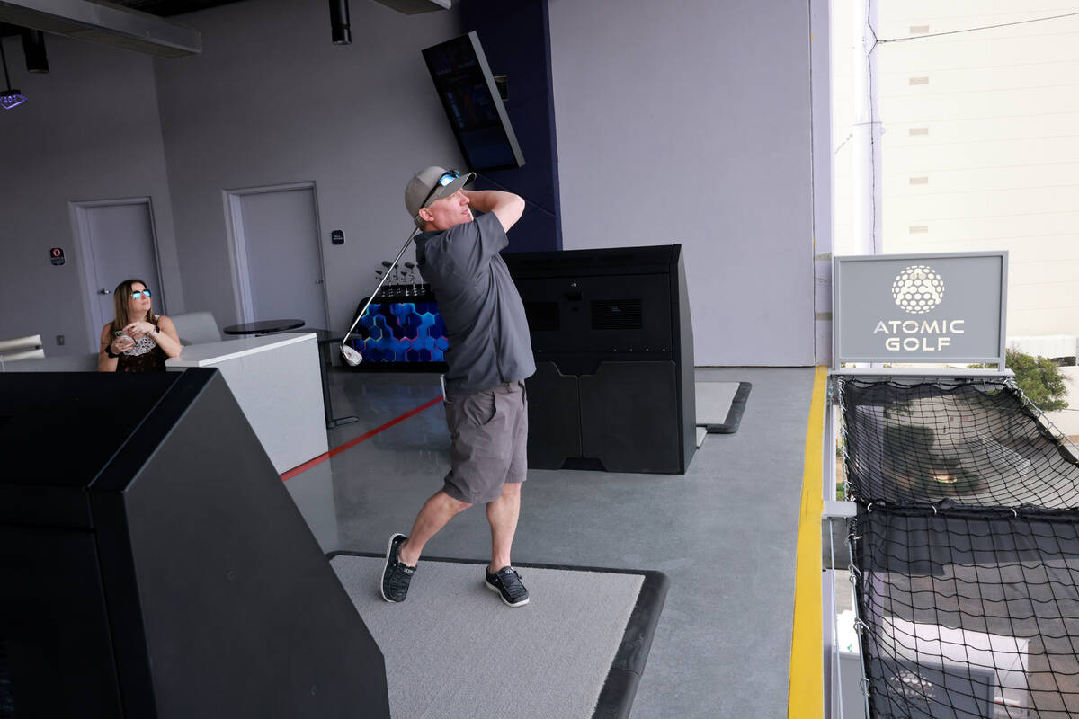 Dave Engstrom of Duluth, Minn. hits from a fourth floor bay at Atomic Golf adjacent to The Stra ...