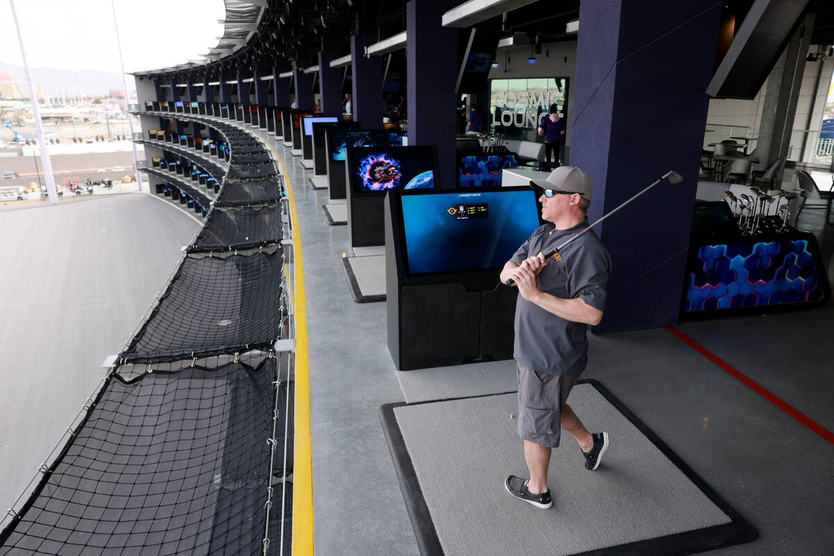 Dave Engstrom of Duluth, Minn. hits from a fourth floor bay at Atomic Golf adjacent to The Stra ...