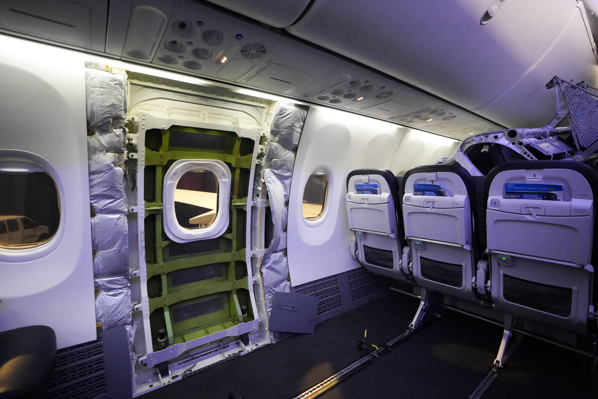 FILE - A door plug area of an Alaska Airlines Boeing 737 Max 9, with paneling removed, is shown ...