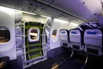 FILE - A door plug area of an Alaska Airlines Boeing 737 Max 9, with paneling removed, is shown ...