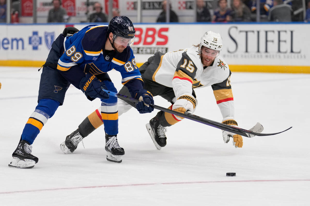 St. Louis Blues' Pavel Buchnevich (89) and Vegas Golden Knights' Noah Hanifin (15) chase after ...