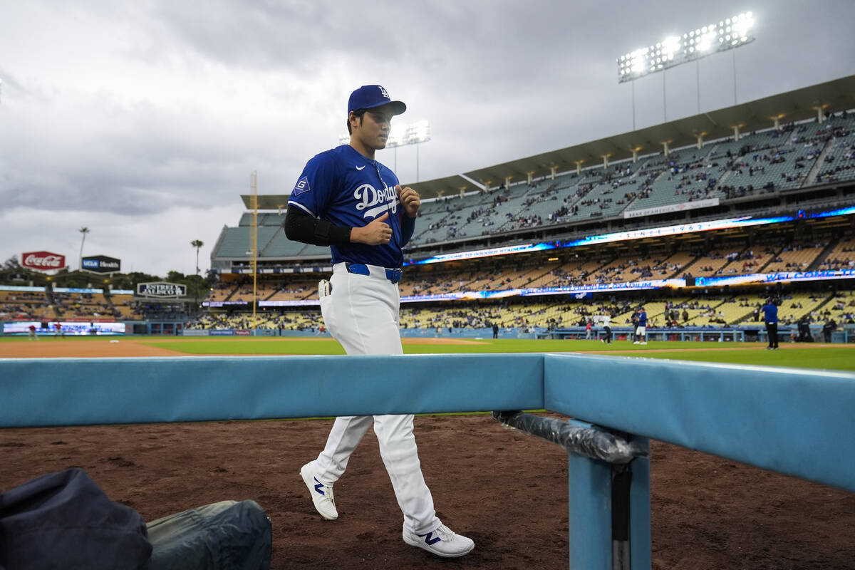 Los Angeles Dodgers designated hitter Shohei Ohtani (17) runs to the dugout before a spring tra ...