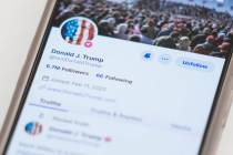 FILE - The Truth Social account for former President Donald Trump is seen on a mobile device, W ...