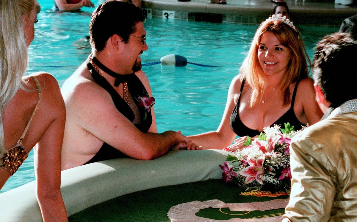 Hamilton and Adina Erridge renew their wedding vows Monday, July 28, 2003 at the Tropicana swim ...