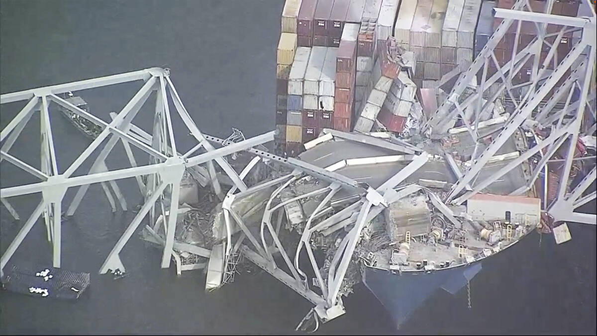 Parts of the Francis Scott Key Bridge remain after a container ship collided with one of the br ...