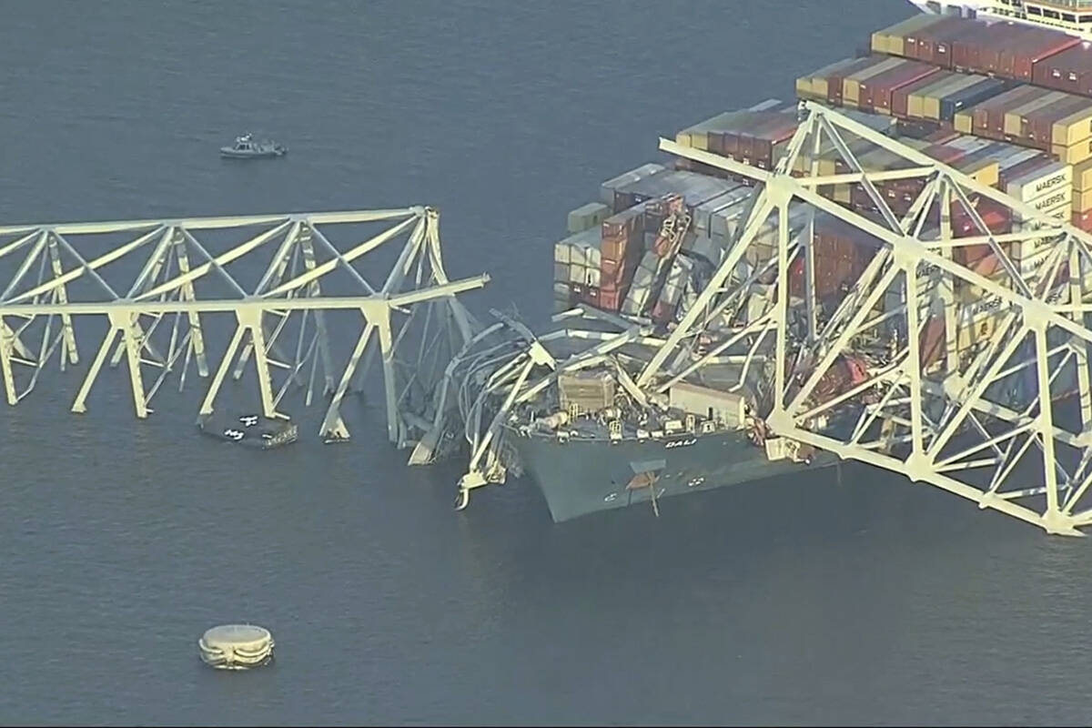 Parts of the Francis Scott Key Bridge remain after a container ship collided with a support Tue ...