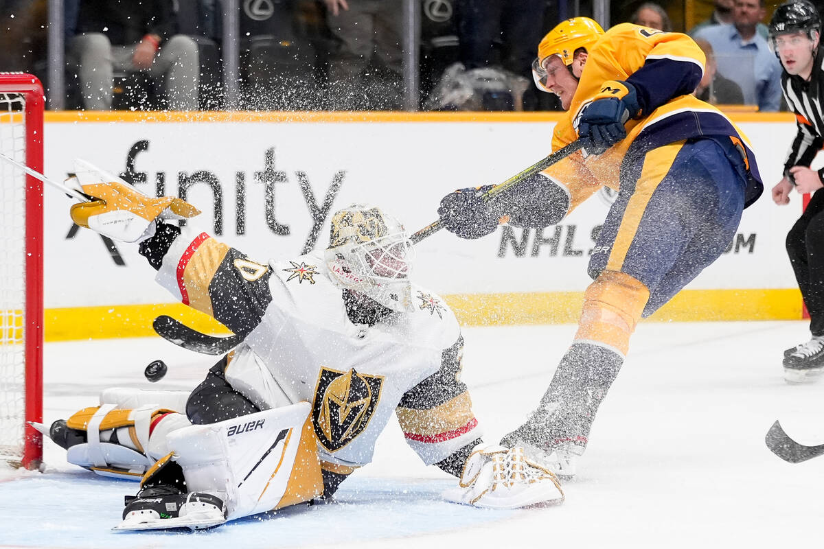 Vegas Golden Knights goaltender Jiri Patera (30) deflects a shot on goal by Nashville Predators ...