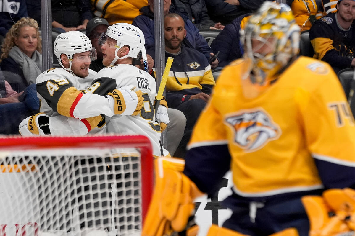 Vegas Golden Knights center Ivan Barbashev (49) is congratulated by center Jack Eichel (9) afte ...