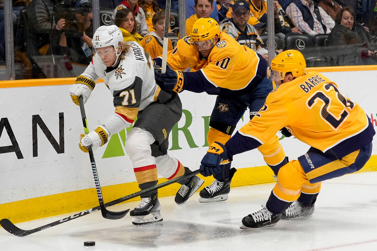 Vegas Golden Knights center William Karlsson (71) chases the puck past Nashville Predators cent ...