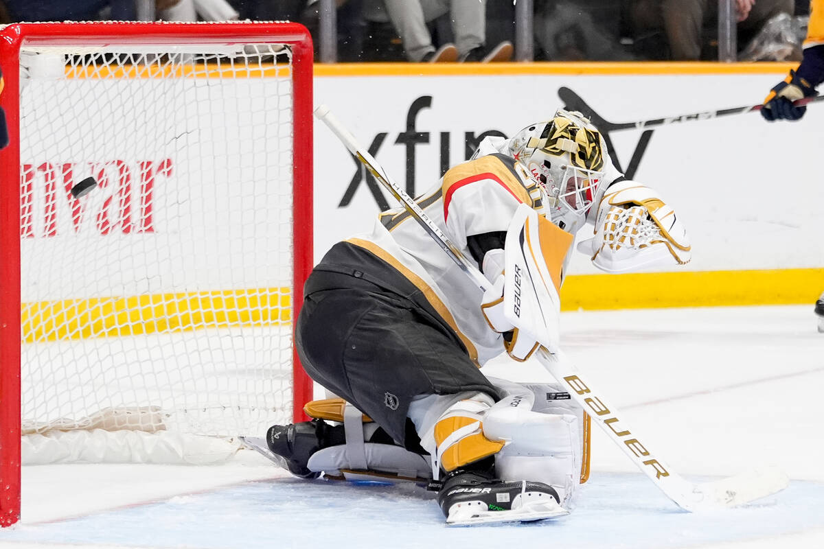 Vegas Golden Knights goaltender Jiri Patera (30) lets a shot on goal by the Nashville Predators ...