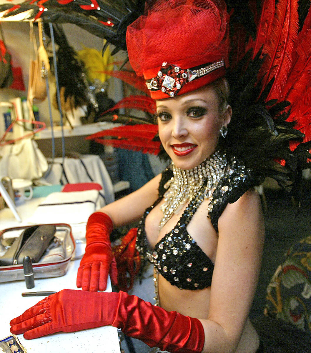 Kim Denmark, a dancer with Folies Bergere at the Tropicana hotel-casino, sits backstage before ...