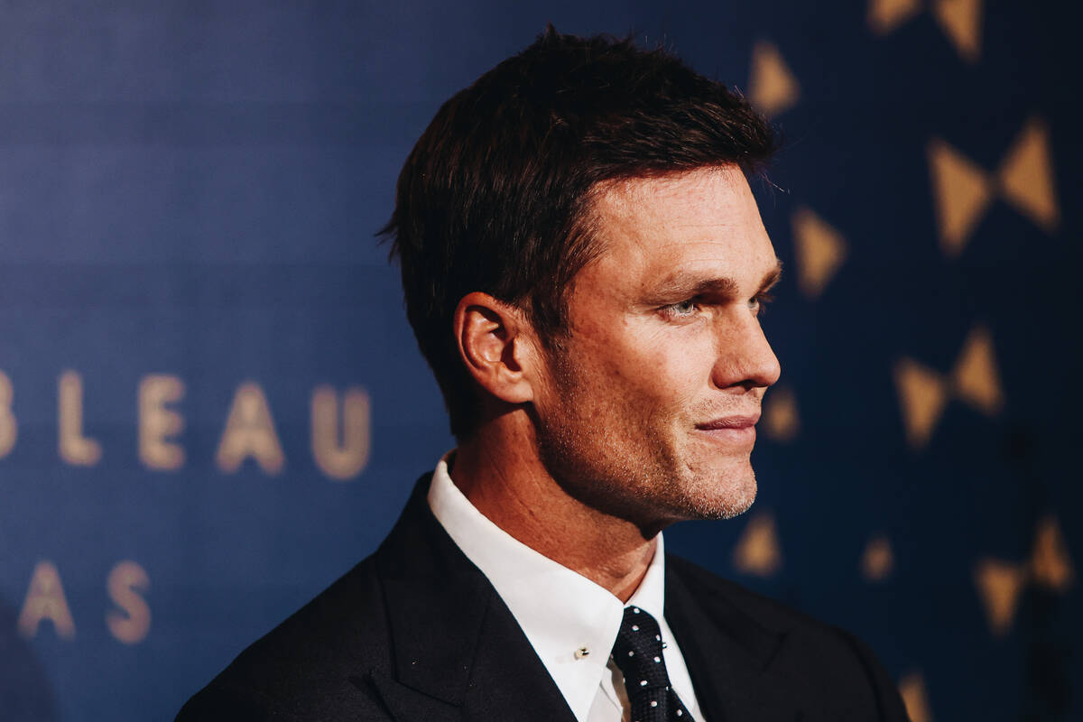 Tom Brady poses for photographs at the Fontainebleau “Bleau carpet” event on Wed ...