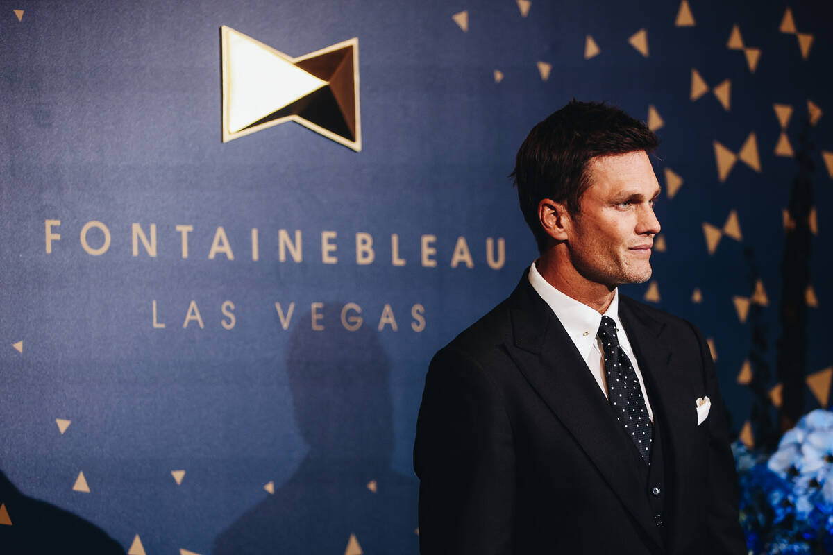 Tom Brady poses for photographs at the Fontainebleau “Bleau carpet” event on Wed ...