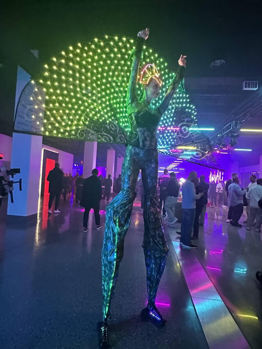 A performer entertains guests at the Las Vegas Super Bowl Host Committee media party at the For ...
