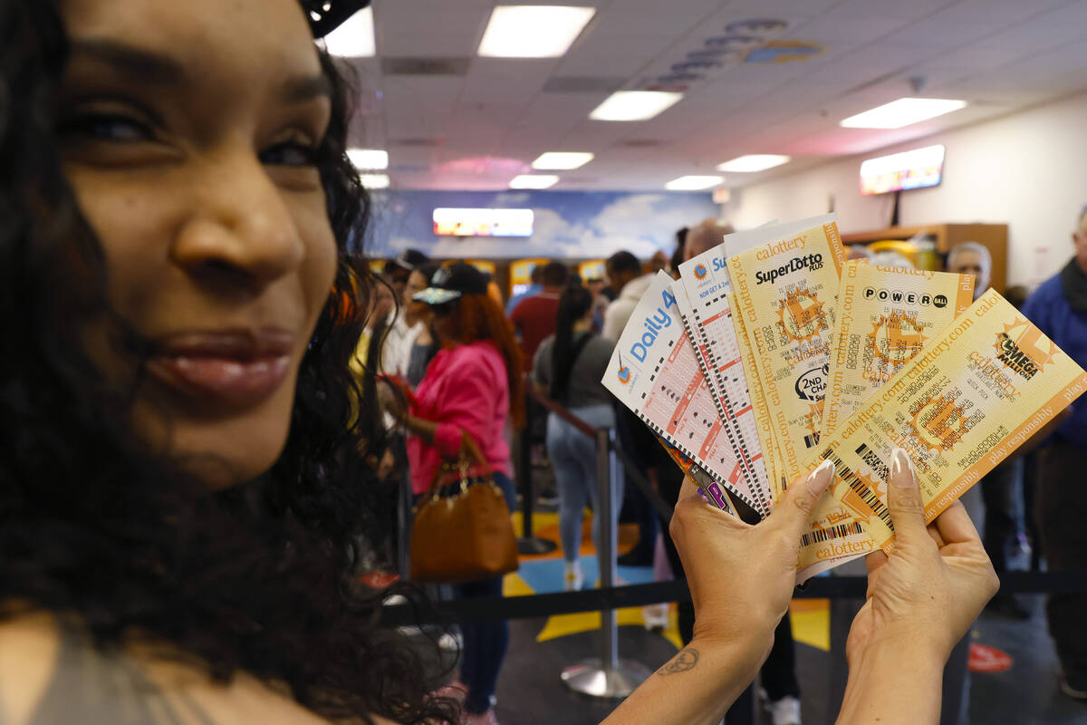 Nikita Davis of Las Vegas shows off her lottery tickets at the Primm Valley Lotto Store on Frid ...