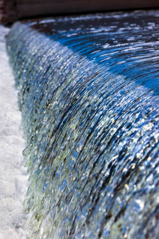 Water flows down the Rainbow Gardens Weir along the Las Vegas Wash on Thursday, Aug. 17, 2023, ...