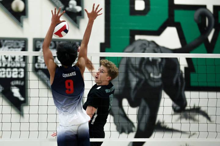 Palo Verde’s Cole Manning (8) hits against Coronado’s Aiden Camacho (9) during a ...