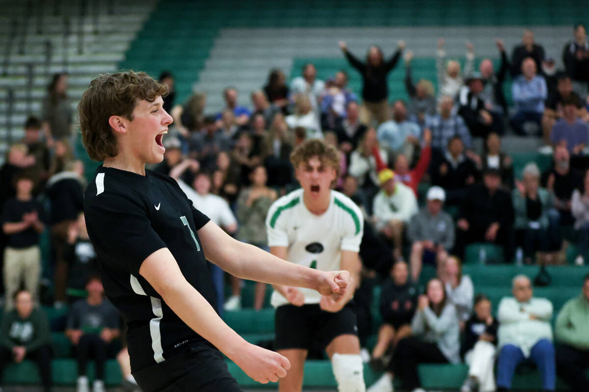 Palo Verde’s Evan Ditmar, left, celebrates a point during a boys high school volleyball ...