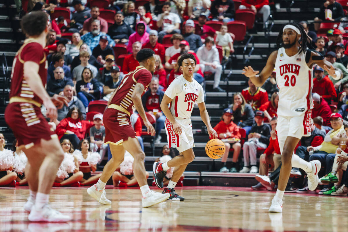 UNLV guard Dedan Thomas Jr. (11) dribbles the ball during a second-round NIT game between Bosto ...