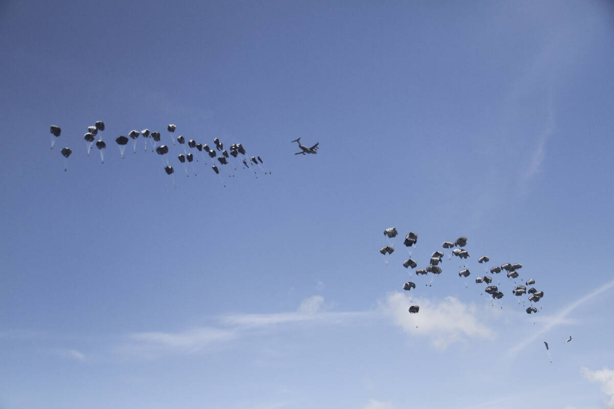 Humanitarian aid is airdropped to Palestinians over Gaza City, Gaza Strip, Monday, March 25, 20 ...