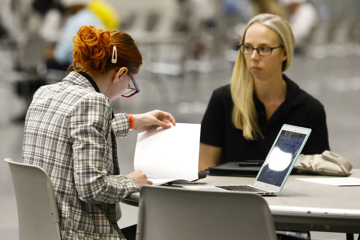 Ashley Warburton, left, HR resources manager at Boys and Girls Clubs of Southern Nevada, review ...