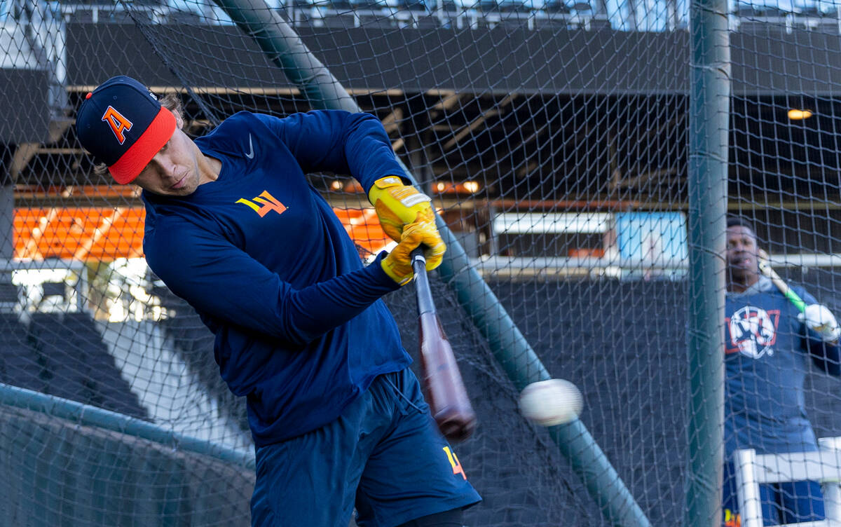 Aviators shortstop Max Muncy connects with a pitch while batting during practice at the Las Veg ...