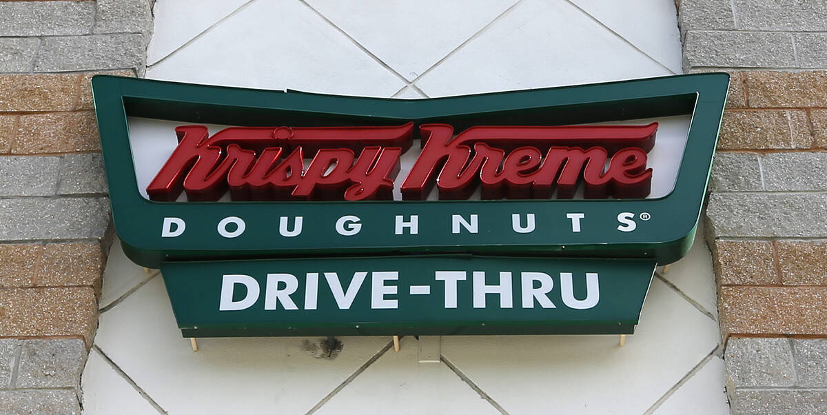 A Krispy Kreme Doughnuts sign is shown on Aug. 11, 2017, in Miami. Krispy Kreme stock jumped Tu ...